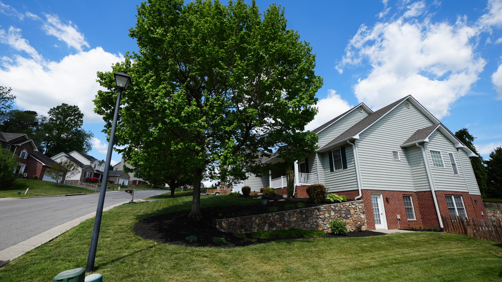 A street in The Village at Hollins with the Blue Ridge Mountains in the background